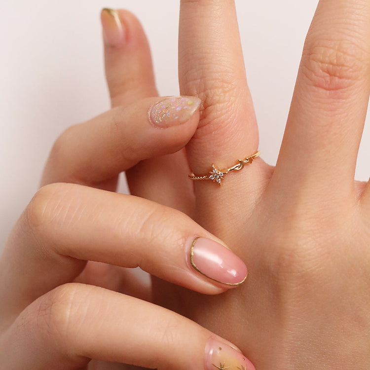 Elegant moon and star ring on a woman&