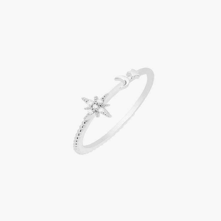 Elegant moon and star ring in silver, featuring intricate details and a sparkling star embellishment.