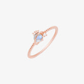 Rose gold Moonstone Saturn ring for women featuring a delicate planet design, perfect for adding glamour to any outfit.