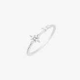 Elegant moon and star ring in silver, featuring intricate details and a sparkling star embellishment.